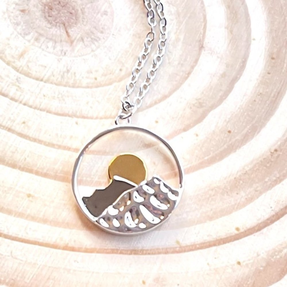 NWT. The Climb. Silver Necklace with Mountain and Sun Pendant.